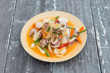 Stir fried squid with salted egg yolk, Thai seafood cuisine