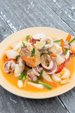 Stir fried squid with salted egg yolk, Thai seafood cuisine
