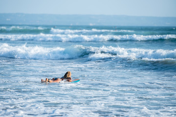 Surfing the waves of Indonesia beach