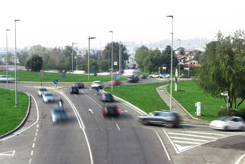 Fototapeta na wymiar Road traffic at roundabout junction