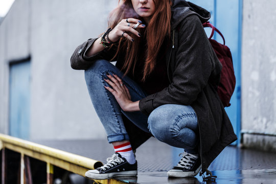 Teenage girl smoking cigarette