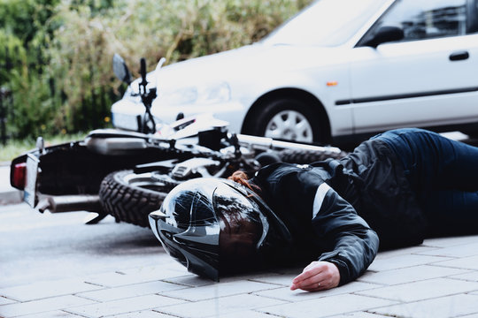 Fototapeta Dead motorcyclist on the road