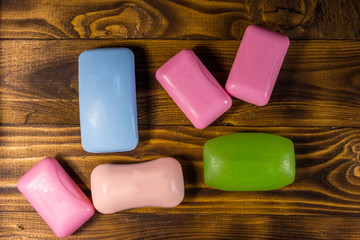 Set of colorful soap on wooden background
