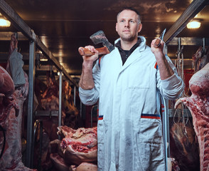 The butcher in a meat factory.