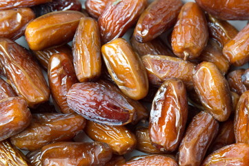 Dry date fruits forming a background