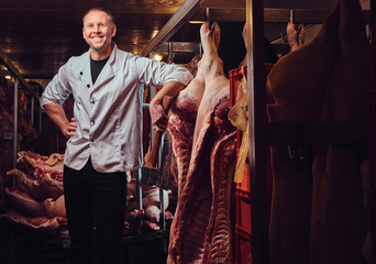 The butcher in a meat factory.