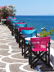 Colorful table and chairs on the street
