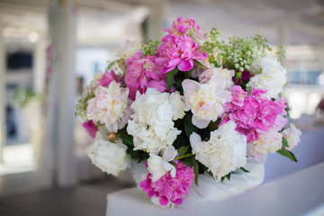 Elegant flower decoration on the table in restaurant for an event party or wedding table