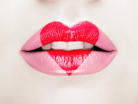 Valentine Heart Kiss on the Lips. Makeup. Beauty Sexy Lips with Heart Shape paint. Valentines Day. Beautiful Love Make-up