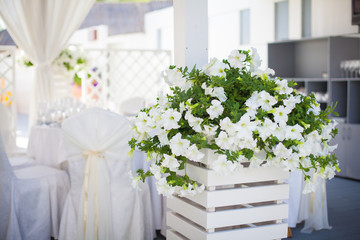 Elegant flower decoration on the table in restaurant for an event party or wedding table