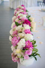 Elegant flower decoration on the table in restaurant for an event party or wedding table