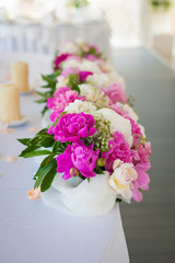 Elegant flower decoration on the table in restaurant for an event party or wedding table