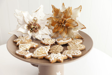 gingerbread cookies on a plate with Christmas motifs