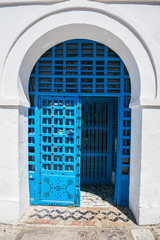 White City. Blue door with open grilles. Tunisia. Sidi Bou Said. 