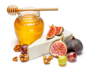 brie or camambert cheese and honey on a white background
