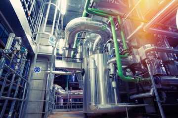 Equipment, cables and piping as found inside of a modern industrial power plant