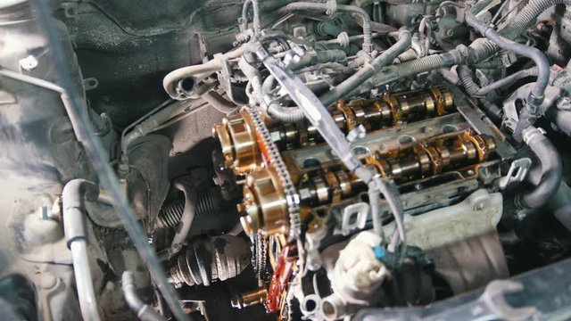 The internal combustion engine, disassembled, repair at car service, overhaul, under the hood of the car