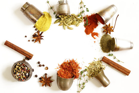 various aromatic spices in metal vintage bowls