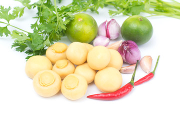 whole champignon mushrooms in brine and vegetable  isolated on white background