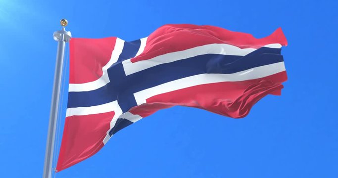 Flag of Norway waving at wind with blue sky in slow, loop