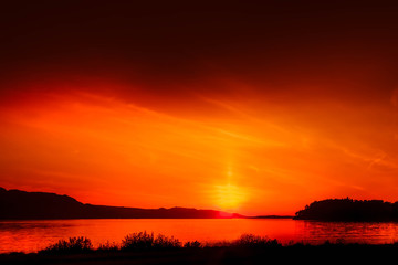 red sunset over loch maree in scotland