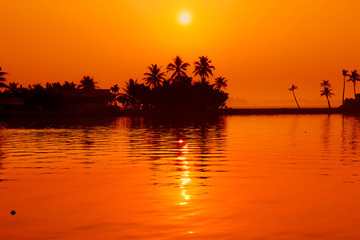 sunset over lake in kerala india mar 2017