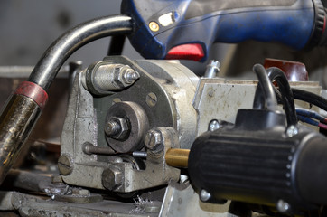 Professional machinist. Horizontal shot of a man operating lathe grinding machine metalworking industry concept copyspace.  Cropped shot of a industry worker at his workshop