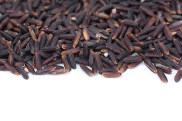 Riceberry isolated on white background. Riceberry is the new variety of rice that has been bred in Thailand. The rice is deep purple in colour is rich in many antioxidan