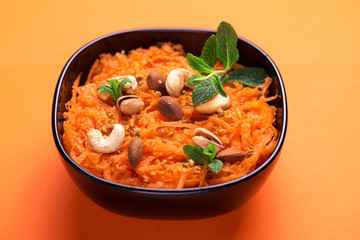 Indian carrot Gajar halwa. Copyspace, top view, flatlay. Color surge