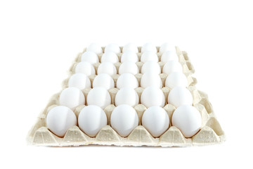 Eggs in tray of carton isolated on white background.