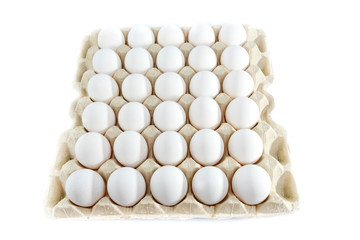 Eggs in tray of carton isolated on white background.