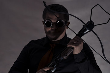 Crossbow in the hands of a young man.