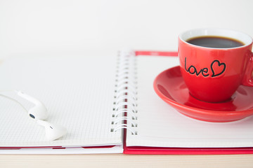 Red coffee cup on notebook, Valentine's Day