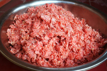 Sour pork ,Pork shredded mixed with rice garlic sugar green chilli  and salt   bound tightly in banana leaves,Food Northern Thailand
