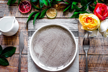 ceramic tableware top view on wooden background mock up
