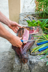 A man cuts a prshut is a national Montenegrin dish.