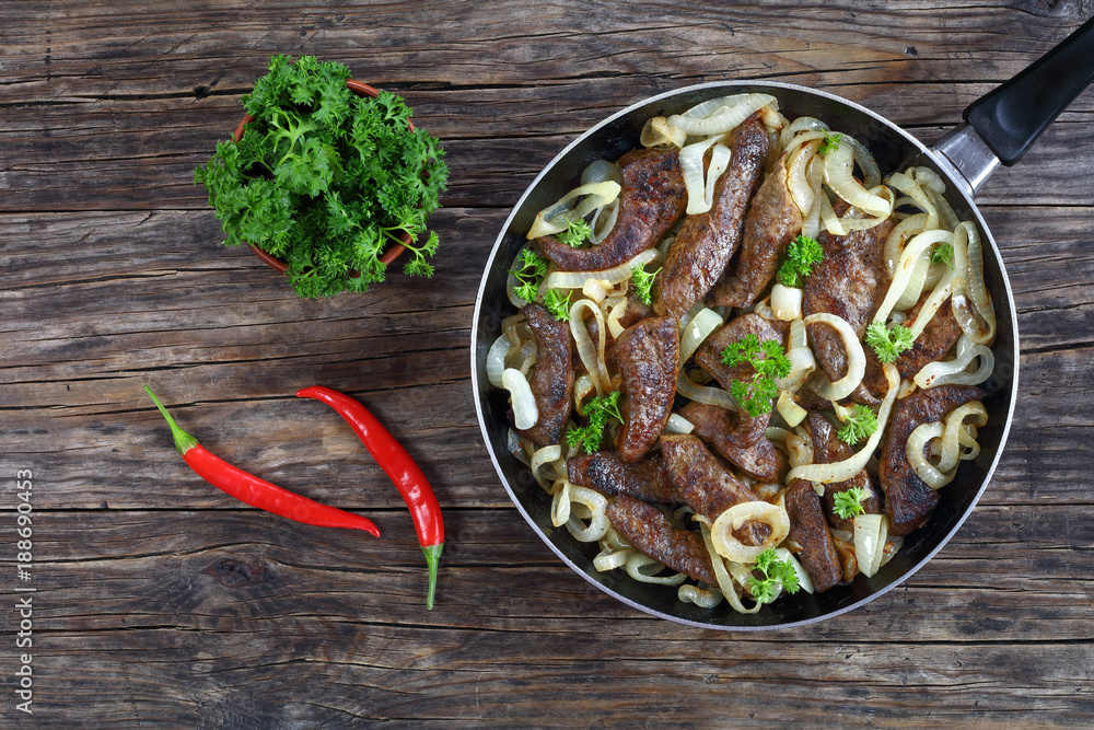 Canvas Prints Fried veal liver with onion rings