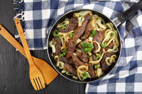 fried veal liver slices in skillet