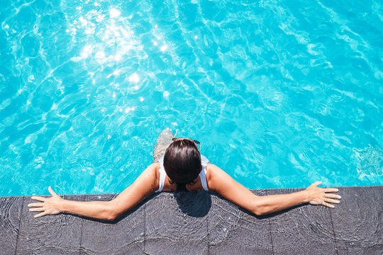 Woman enjoy the sun in swimming pool