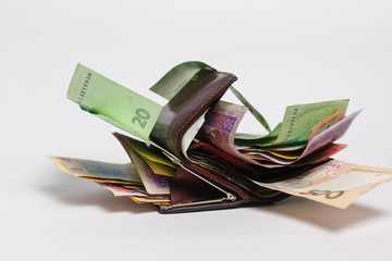 Ukrainian hryvnia banknotes in denominations in black purse isolated