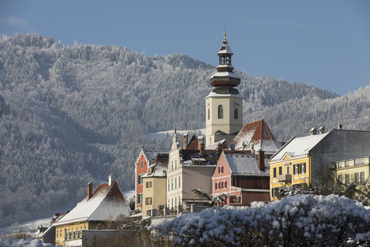 cityscape frohnleiten on river mur in winter, styria, austria