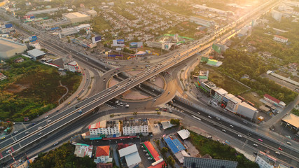 Aerial view, Road roundabout, Expressway with car lots in the city in Thailand.  beautiful Street , downtown, cityscape, Top view. Background