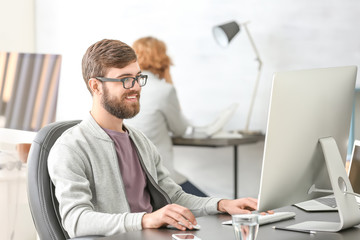 Manager working with computer in office