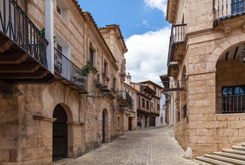 Typical narrow street with cobblestone stairs and colorful houses in old town. Toledo, Castilla La Mancha, Spain, Western Europe. - obrazy, fototapety, plakaty