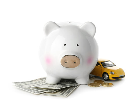 Piggy bank, money and toy on white background. Concept of buying new car