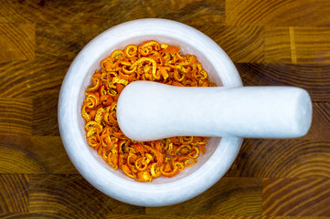 White marble mortar with the orange zest