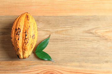 Cocoa pod on wooden background
