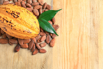 Composition with cocoa pod on wooden background