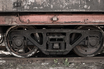 Fototapeta na wymiar Abandoned old rusty soviet locomotive at platform. Horizontal color photography.