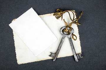 Rusty key and empty photography as a memories metaphor. Copy space